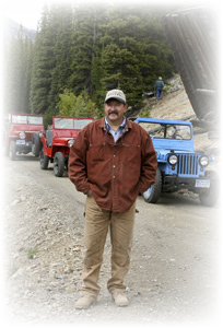 Mike, the Blue Mule, and the CFFC Fall Color Tour jeep group posing on the road to Hancock